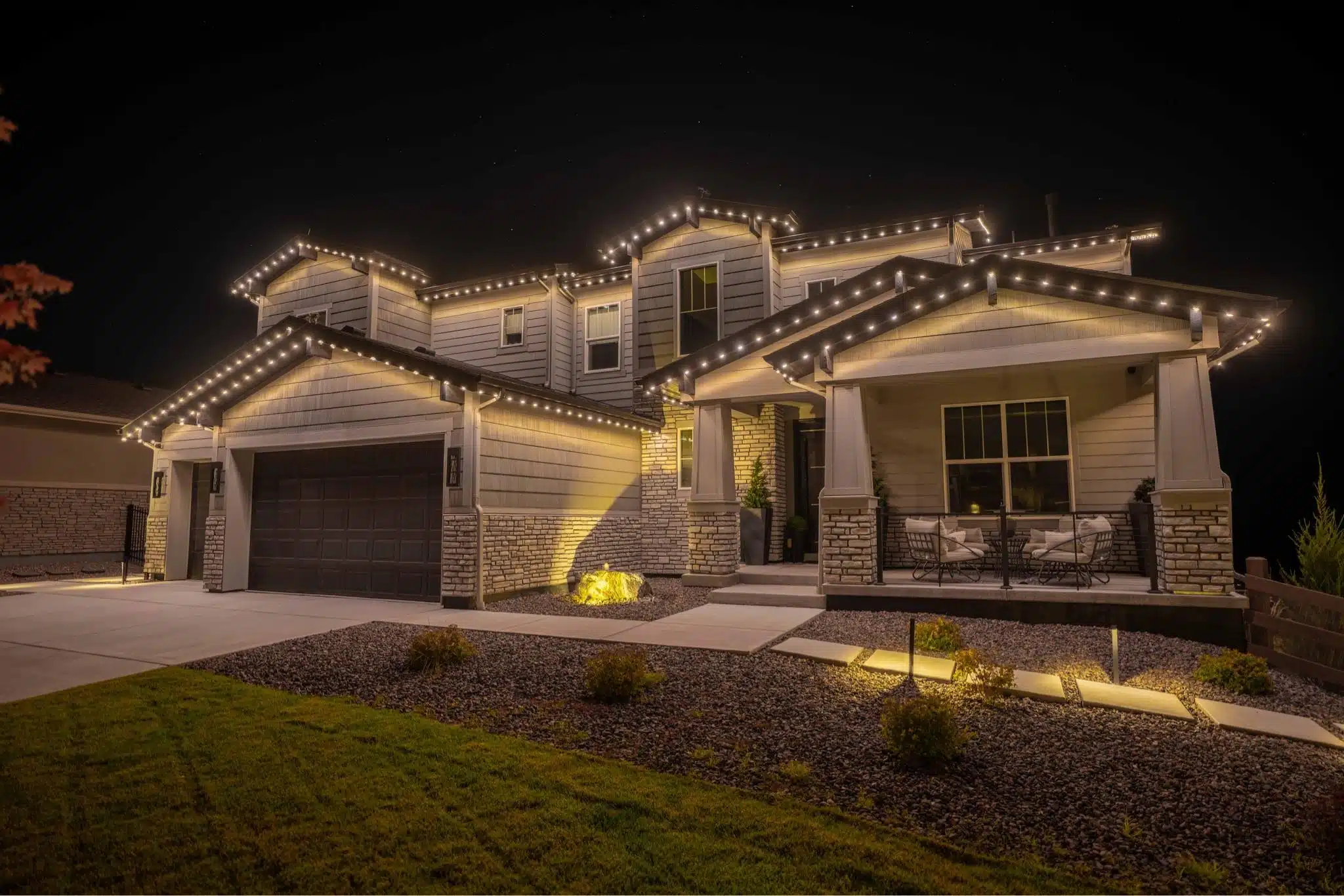 Home with warm-white roofline lighting